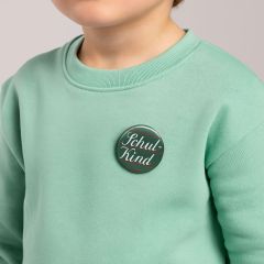 Ansteckbutton SCHULKIND von Krima Isa